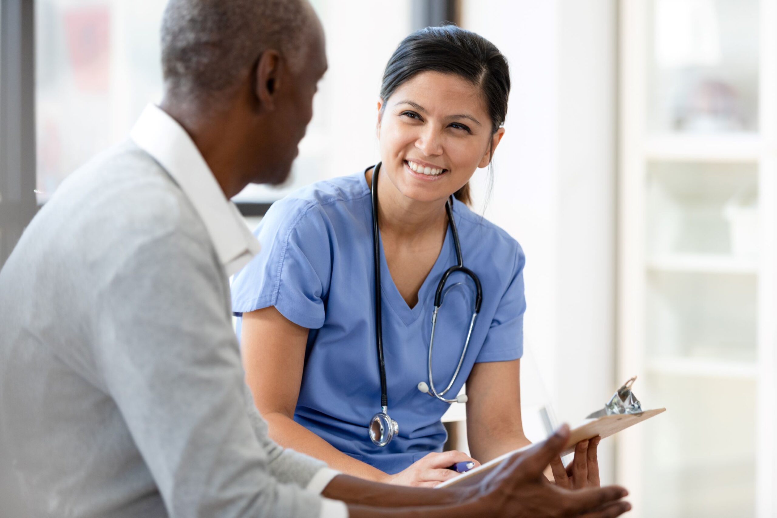 A picture of a health professional with a patient during consultation